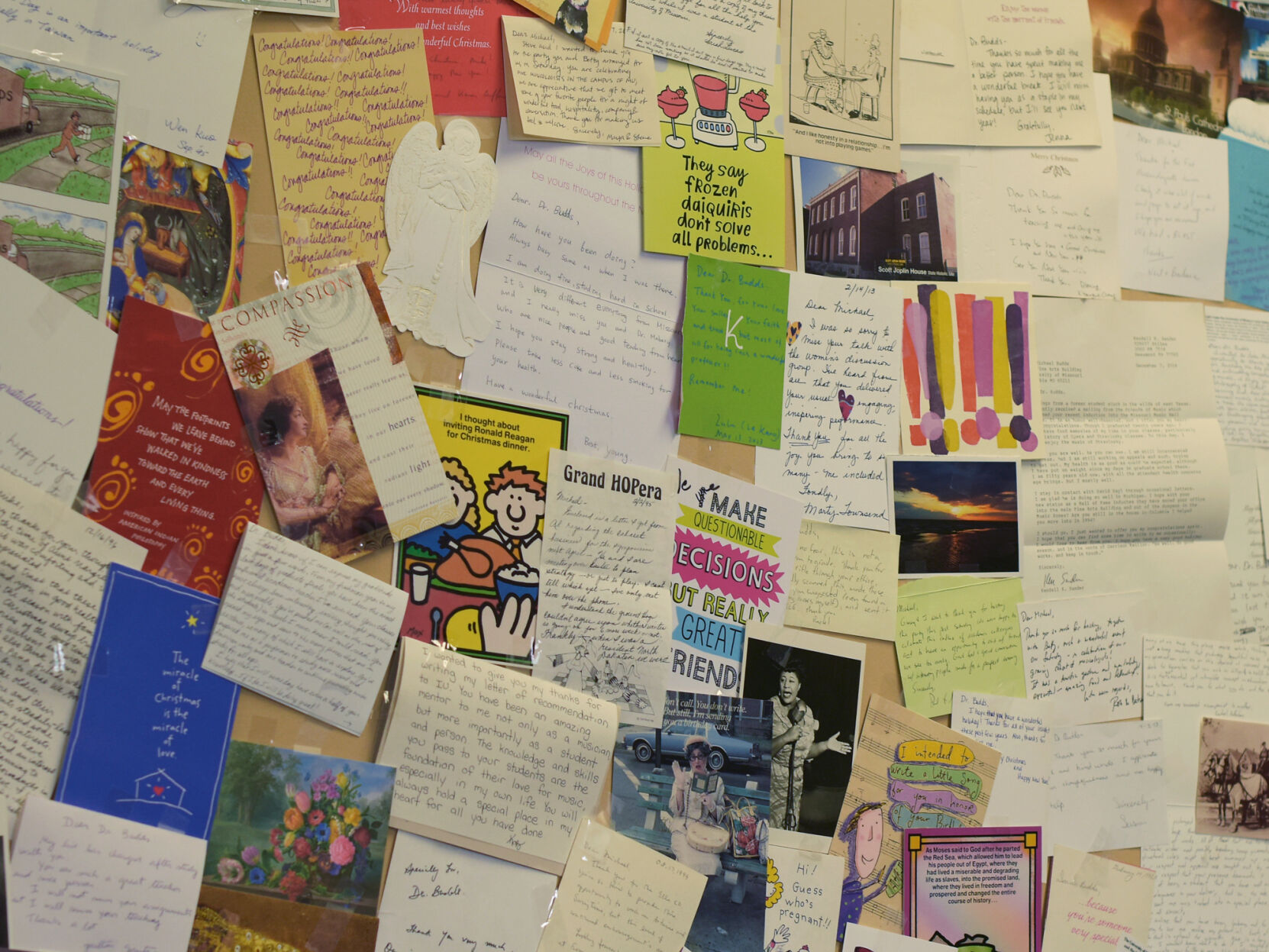 A wall display of all the thank you cards is pictured